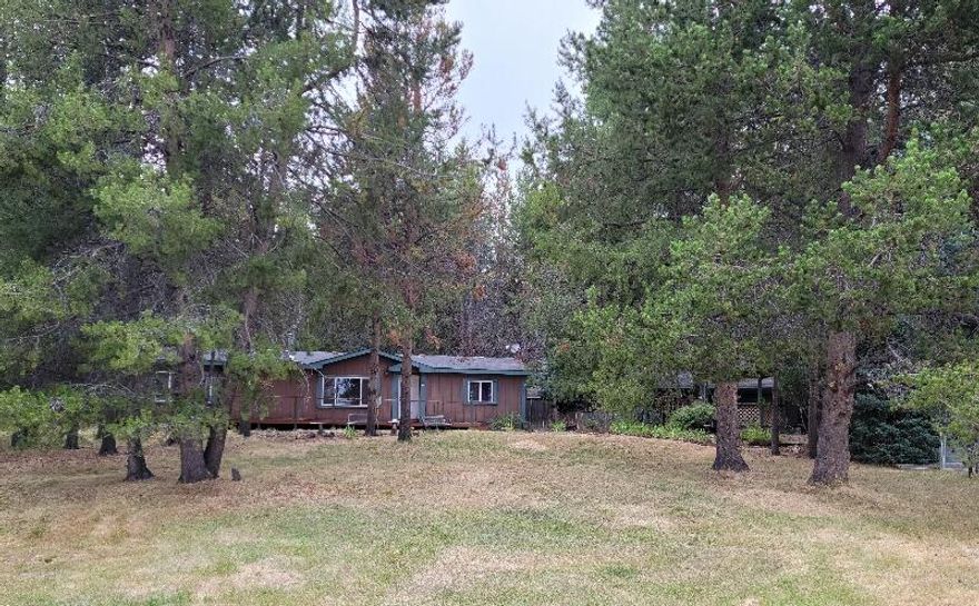 Lazy River subdivision! This home sits on 1.18 acres with a beautiful view of Paulina Peak. Also, it's steps away from access to the Little Deschutes river! Home features vaulted ceilings, 3 bedrooms 2 baths, w/a open floor concept. Spacious kitchen w/walk-in pantry. large W/D room w/back entry. lots of storage space. Some updates done recently, which include whole home interior paint, PEX pipe throughout the house, new ''underbelly'', & water heater. There is a large full-length front deck and a small covered back deck. Large tandem garage/workshop, bench included (this was the old Quail Run Golf Course clubhouse and moved here) has a nice side door entry. RV parking w/hookups. several outbuildings: ''She Shed'' that is finished inside & has power. Garden shed w/power, wood/tool shed, metal storage shed. Backyard is fenced. Rock water feature w/nice gazebo compliments front yard. Septic pumped in 2021.
NOTE: This is a ''estate'' situation, the home is being sold in ''as is'' condition