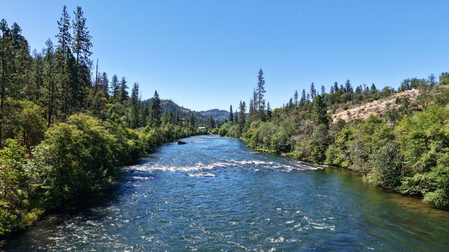 Rare opportunity to own a 4.75-acre riverfront parcel with homesite approval! This stunning property offers privacy and natural beauty, bordered by BLM land on two sides for added seclusion. Located just minutes from Shady Cove, it lies on the private, gated side of the river, ensuring peace and quiet with limited access. Build your dream home or getaway retreat with direct river frontage and room to roam. Enjoy wildlife, fishing and the tranquil sounds of the river, all from your own private escape. This one is ready for your vision.