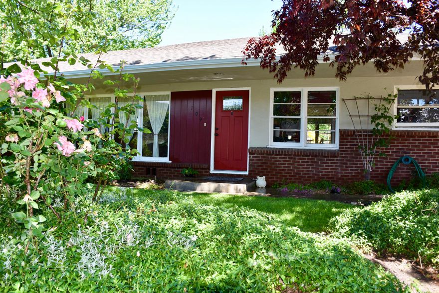 Ashland mini-farm!  Mid-century charmer with coffered ceilings, hard wood floors, double hung wood windows, tiled bath and kitchen, and huge custom stone fireplace. Kitchen has stylish black and white tile tops and new over-sized range/oven. Eating nook in additional to formal dining room. New roof and newer heat system.  Nice pasture and barns.  Garden plots full of growing veggie and a prized pumpkin patch. Talent Irrigation.   
Two car garage and additional covered parking for RV's and/or cars.