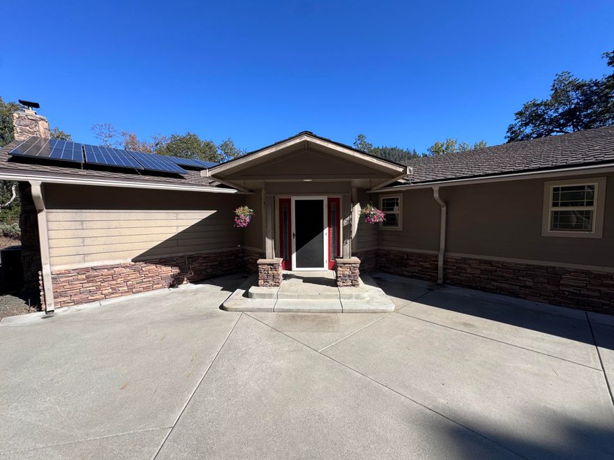 E Evans Creek home on 7+ acres! From the back deck you can enjoy the sounds of mother natures water feature and spectacular views of year round E Evens Creek. Home features 3 bedrooms, each with their own private bathroom, spacious kitchen, dining & family room. There is a pellet stove in family room & a wood stove in kitchen/dining area. Kitchen has granite counters, stone accents, walk-in pantry, and island. Primary suite features French doors to the deck overlooking the creek, skylight, over-sized walk-in closet to private laundry room, two sink vanities and a massive open shower with dual shower heads & a soaking tub. The recessed family room has 2 built-in desks & cabinetry, it also makes a great theater/media room. Laundry closet in the hall serves the other 2 suites. 6 car detached garage, 2 spaces have been enclosed to create a nice space for your hobbies, creafts, or additional storage.