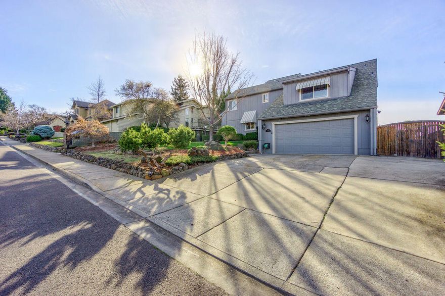 Beautiful updated Manor Hill home w/Views of the City lights, Valley & Mountains. Lg vaulted wood ceilings in Great rm w/brick wood burning fireplace, dining rm w/ slider to a beautiful backyard all fenced, lg cement patio for entertaining. 2nd paver patio for relaxing. 3rd patio off kitchen w/French doors. A great courtyard breakfast patio. Nice stainless appliances w/gas cook top, wall oven, Corian style counters & white cabinets. 80% of the home has new beautiful water proof flooring. Master on main floor w/ slider to patio. Marble counter in bath, lg tile shower. 3 bdrms upstairs w/ updated bathrooms, dbl sinks w/ Carrera marble counters & great storage closet. Great office/hobby rm off 4th bdrm. Open railing into great rm/dining rm from upstairs hallway. Beautiful inside & out!