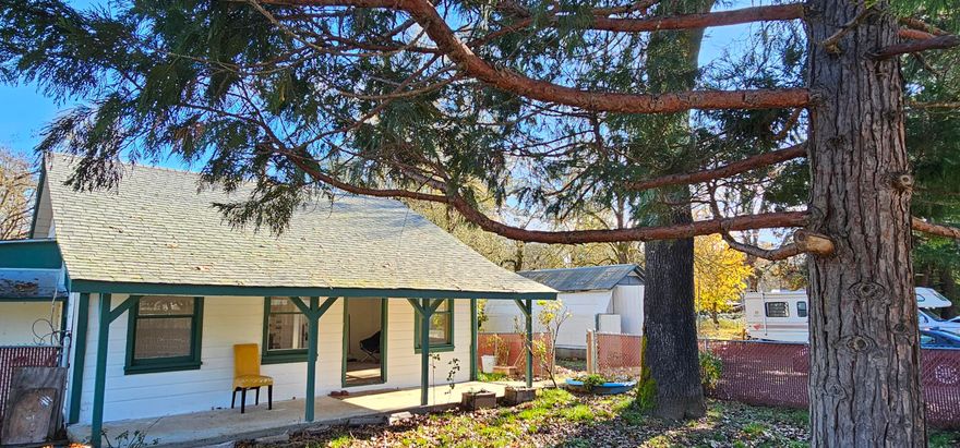 Beautifully maintained home just outside city limits at an incredible price! Attractive and affordable, this charming 2-bed, 1-bath home is conveniently close to town and local amenities, offering the perfect blend of easy living and potential. Step inside to find recent updates, including fresh paint and new laminate flooring. Enjoy a cozy woodstove, abundant natural light in breakfast nook and living areas, and a smart, efficient layout that maximizes space with ample storage. Outside, make use of the covered front porch and fenced front yard. The lot provides room for a garden and outdoor projects with the detached 288 sq ft garage, full fencing, and a gorgeous mature shade tree. Nearby Illinois Valley Forks State Park offers disc golf, walking paths, hiking trails, and river access just minutes away. Clean, move-in ready, and ideal for a first-time homebuyer or an investor seeking a low-maintenance rental. Schedule a showing today before it's gone. Don't miss this opportunity!