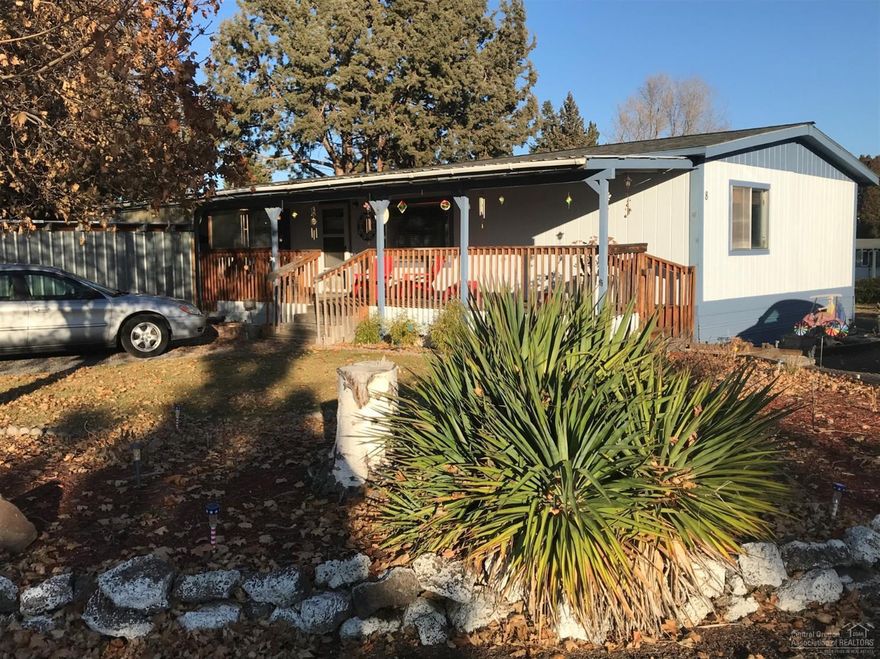 This home has it all in the back of this family park with beautiful sunsets and 2 covered porches. Bright and open floor plan with skylight. Kitchen includes updated stainless steal appliances. Built in hutch. Newer roof, heat pump, AC, sinks and walk-in shower. Remodeled master bathroom with walk-in closet + great separation. Utility room with washer and dryer included. Yard includes yearly flowers and walks on canal with plenty of privacy. Carport/garage and your own she-shed. $425 monthly space rent includes water, sewer and garbage. No sublease. Owner occupy only.