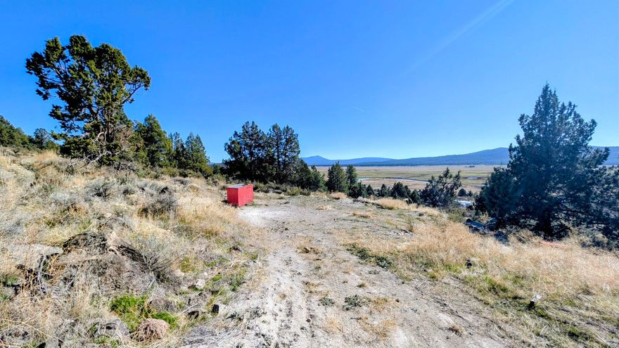 THIS PROPERTY HAS A WELL AND WELL HOUSE. 1.55 ACRES. NICE VIEWS! BUILDABLE LOT. OVERLOOKS THE SPAGUE RIVER AND VALLEY. HAS A DRIVEWAY THAT IS DIRT. SOME LEVELING. DEBRIS WILL BE REMOVED OR BURNED AS MUCH AS POSSIBLE. CURRENTLY NO POWER, SELLER HAS USED A GENERATOR TO POWER THE WELL.