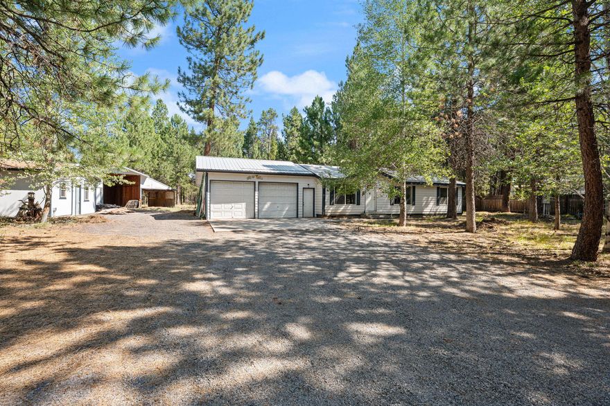 Adorable and fully remodeled, this charming 2-bedroom, 2-bathroom home sits on just over an acre of private, tree-filled land. 

Inside, you'll find a light and bright open floor plan with large windows and a cozy pellet stove. 

Outside, enjoy a spacious and fully fenced lot with ample parking, RV hookups, and room to roam. The property also features a generous two-car garage, a large shop, and a separate hobby building—perfect for projects or extra storage. With extensive updates already completed, this home is move-in ready and waiting for its new owners to enjoy!