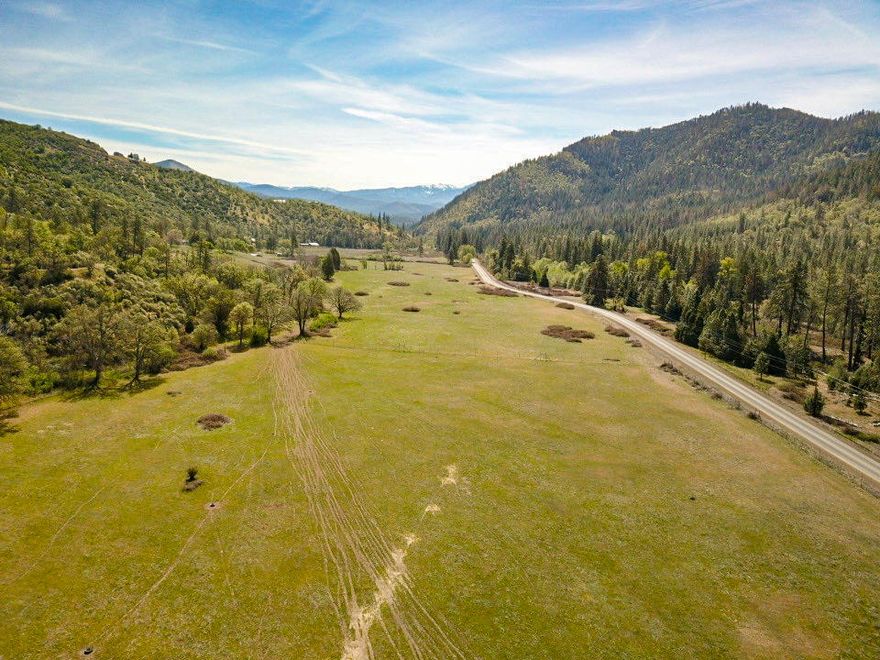 Amazing Turn-key Ranch in the Sunny Applegate Valley! A short 15 min drive from Medford, OR is this large turn-key farm/ranch property. The property itself feature 133+ acres, 47 acres irrigated (1854 priority date) by the main Applegate River, fed to the property line with an 8'' mainline with numerous risers running the length of the irrigated ground. Completely fenced and cross-fenced with an additional 80+ acres of ultra healthy grazing ground, year round spring, seasonal pond, plus and additional 5,000 acres of BLM bordering the property lines. The main home, located well off the road features 1 main bedroom, large open concept with concrete floors, huge wood burning stove, and expansive views from every angle! There is also a large wine cellar, an additional ADU (with full bath & kitchenette), large stick-built greenhouse with bathroom, 30x40' barn with woodshop area, bathroom, and stalls. The views are virtually unmatched with a location that can't be beat. Don't miss this one!