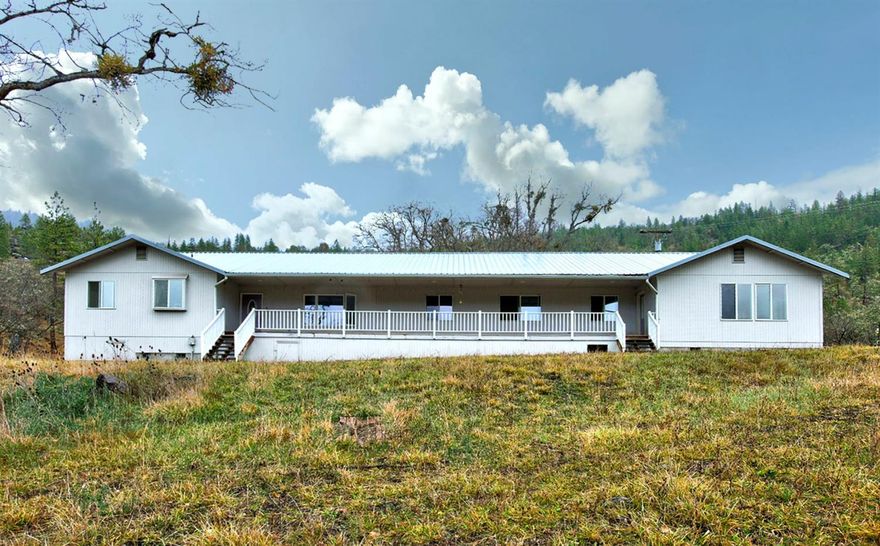 This two - family set up of over 3,000 sq ft offers a unique opportunity to own 17.36 acres of land with serene mountain views within minutes to town. It's a private homestead just waiting for a personal touch. It also comes with a fully updated two bedroom cabin, plenty of storage, and additional parking for whatever your needs may be. The five bedroom and four bath home has two large kitchens, and plenty of room for entertaining. Come visit this country living property today!