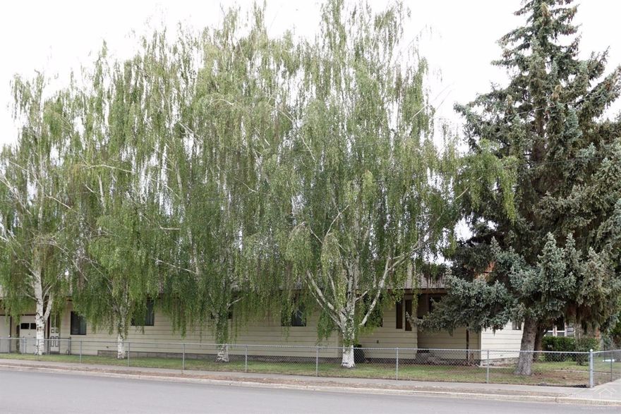 Large home on corner lot, close to parks and down town. Property is zoned C3, check with county on possible commercial uses. Home has 3 nice sized bedrooms, 2 full baths, a living room and family room both with fireplaces, a formal dining room, large kitchen with tons of storage, lots of built ins throughout and a full basement (approximately another 2400 sq ft.) with pool table and cold storage room. The home sits on a corner lot with mature trees, fully fenced with a covered back patio.