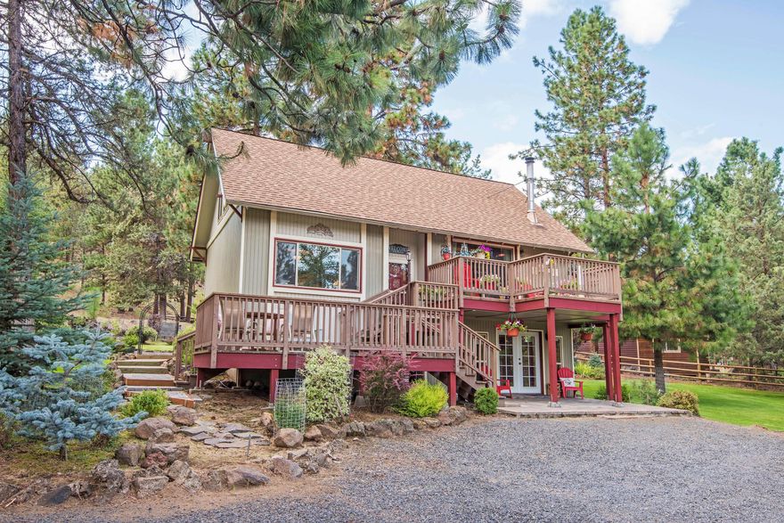 Updated and meticulously maintained chalet on a parklike 1+ acre setting. Features: vaulted tongue and groove cedar ceilings upstairs and in living room;
open living concept; remodeled main bathroom with tiled floors, solid surface countertops in kitchen, Greek soaking tub, Italian tile, granite counters and
bronze fixtures; multiple sitting decks and patios for outdoor living; a private lower level with studio apartment - full bathroom, kitchenette, bedroom, living
space and private covered patio. Upgrades since 2010 include: New roofing throughout; New windows and slider; New HVAC system - forced air, heat pump
and AC; New hardwood floors; Detached 20' x 24' garage (with additional attic storage); Dedicated RV parking; New lighting throughout entire home; New
paver patio, pavers in front of garage and on one side of the house; New in ground sprinkler system and timer; New wood stove