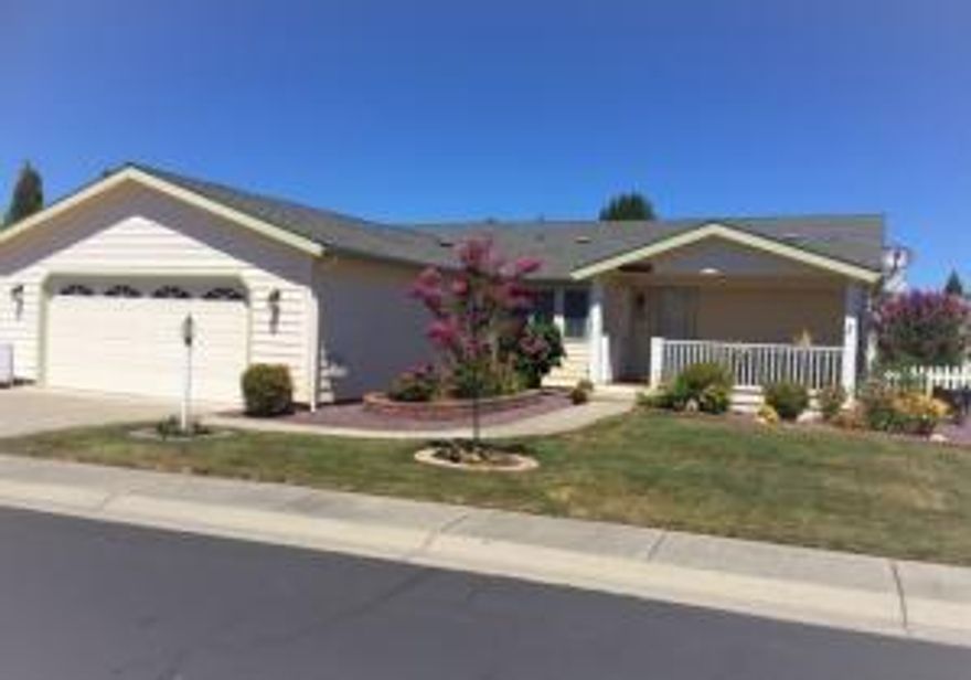 NEW PRICE! Located in the 55+ Miller Estates community.  Enjoy a friendly community with its own private park! This a 3-bedroom, 2-bath Manufactured home.  Kitchen has double sinks with a Insta Hot Water and a window above. Plus, lots of cabinets, a large pantry and an eating area.  More formal dining area and great room/living room with an area for library, office, craft/sewing or other.  Primary is large with a large walk-in closet and a bath with a garden tub, walk-in shower, linen cabinet and double sinks.  Newer HVAC, new tankless water heater and flooring throughout.  Ceiling fans, indoor laundry w/solar tube and a finished 2-car garage w/automatic door opener.  Backyard is fenced, has a 12x10 garden shed and covered back patio.  Low maintenance yard w/sprinkler system and covered front porch.  Well maintained.  Truly a place you can call home.