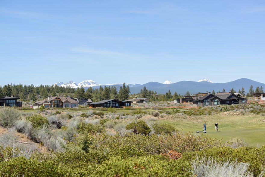 Gorgeous Tripleknot townhome on the 10th fairway in the coveted Tetherow golf community. Incredible, unobstructed Cascade Mountain views. Lovely great room with floor to ceiling windows, stylish fireplace treatment adds architectural detail. Tranquil master suite boasts mountain and golf course views. Spa like bath, double vanities, soaking tub and tiled shower, spacious walk in closet. Private office on the main floor. One upper level Jr suite overlooks the golf course and features mountain views. Second guest suite upstairs as well. Covered patio with electric shades for privacy and sun protection. Spacious 2 car garage with room for extra storage. Fantastic outdoor living and resort amenities at your doorstep. Mount Bachelor Ski Resort is just 20 minutes! Downtown Bend is just a few roundabouts away!