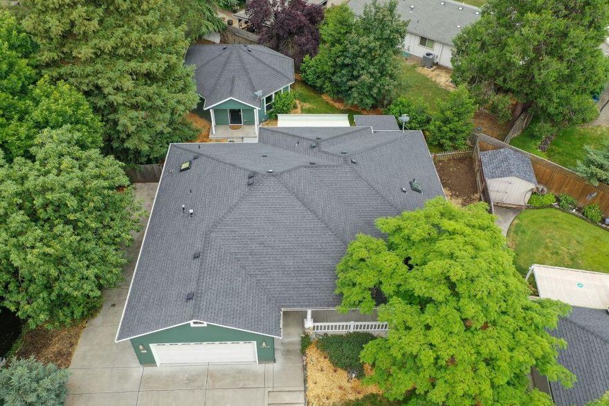 2 houses for the price of 1 & separate addresses included in this rare opportunity in desirable East Medford! Quiet and at the end of a private driveway in a park-like setting sits an amazing investment or 2 family set up on a large .26 acre lot, separate utilities. The main custom built by Mahar house is 1867 Sf with an open modern concept 3/2 w/ large bedrooms and a 200 sqft bonus room. Open kitchen with custom cabinets, Granite countertops, Hardwood floors and great bar seating. Large master suite with walk-in closet, and gorgeous bath. High end touches throughout the houses with lots of natural light, coffered ceilings, Trex decking, nice hot tub, large RV pad. Guest house which would make a great rental or guest house. This is 781 Sf and has a large bedroom, open concept with nice kitchen, indoor laundry and is private. Located in the desired Lone Pine school district, Hedrick, and North High. $5,000 credit for green carpet, or anything you want! Can also take $5000 off the price.