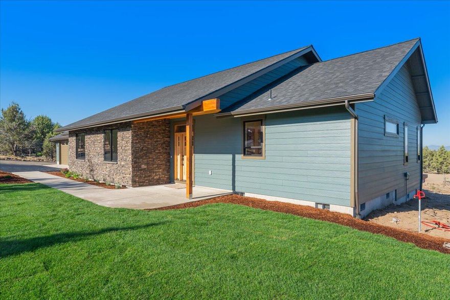 Beautifully crafted new construction home with Cascade views! Located in an exclusive gated community with over 150 acres of common area, a few minutes to the Prineville Reservoir and still just 15 minutes to town. This custom home is 2381 sf, with 3 bedrooms, 2 bath, 3 car garage, on over 2 acres and stunning views. Finishes include quartz countertops throughout, alder doors and trim, stainless steel appliances, custom cabinetry, heated floors in primary bath, tankless water heater and two decks, including a private deck off the primary bedroom. Whether you're enjoying the view from your back deck or entertaining in the open-concept living area, this home is designed to impress. Schedule your tour today!