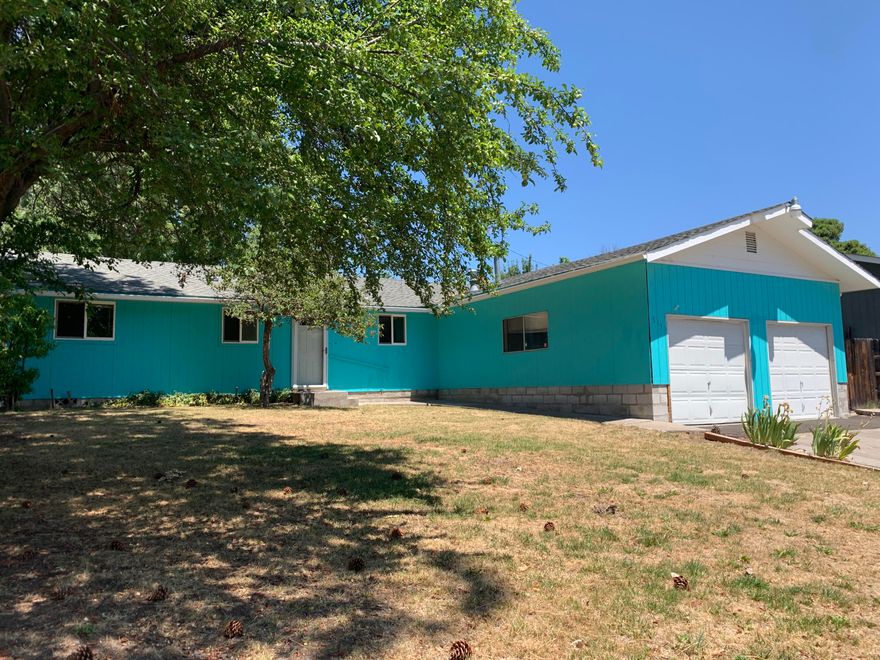 Wonderful 3 bedroom/1.5 bathroom home with attached, oversized 2 car garage! Located in a quiet neighborhood, this property features a nicely-sized front yard and wonderfully private, fenced backyard including a great storage shed, small fire pit area and room for gardening and entertaining. Inside boasts a great kitchen with gas range, large living area open to kitchen and dining area and tons of natural light from large windows. Separate laundry room with half bath located off garage. Bedrooms are nicely-sized with good closets. This one is ready for you to move right in! Schedule your appointment today.