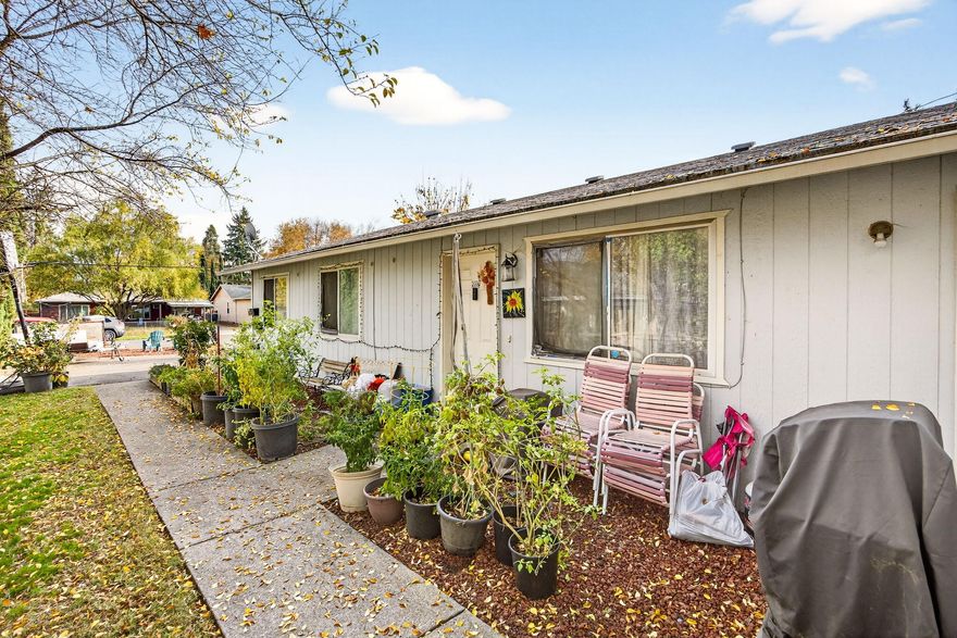 Great duplex located close to schools, shopping and medical.  Each unit is 3 bedrooms, 1 bathroom, 1022 SQ FT with utility rooms with laundry hook ups in each unit.  Kitchens with electric ranges, sliding door to private fenced backyards.  Each unit is currently rented for $875.00 each per month.  Large .26 acre lot offers lots of parking.  Neighboring property with 3 commercial spaces & 2 apartments also listed for sale.