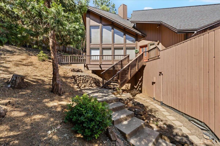 Don't miss out on this architectural masterpiece located in the heart of Jacksonville with multiple ways to enjoy the outdoors. This one-of-a-kind home has a large deck with beautiful views, large patio off the back and a balcony off the kitchen. Home sits on a beautiful .83 acre lot which has an A+ rating for fire safety. As you enter this 1,544 sq ft home you're welcomed with gorgeous vaulted ceilings, large windows with custom blinds and amazing wood floors. The kitchen features tile countertops, a large view window and access to a balcony. This home feels cozy with an edgy design and nods to a classic Santa Fe style. Large 2 car garage, plenty of additional parking, tons of storage and a nice 12x12 shed. Enjoy all that Jacksonville has to offer including restaurants, shops and the Britt Festival in under 5 minutes.