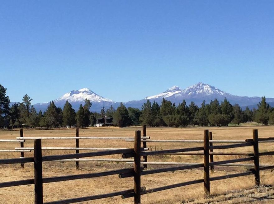 Great location with Cascade Mountain views from living areas, deck, and most of the property. Horse set up with public land nearby. 7 stall horse barn, equipment shed, shop with 2 stalls & separate guest quarters. 3rd bedroom and bath are located in the guest quarters. 7 ac. of irrg. and complete perimeter fencing with cross fencing for large pastured paddock areas. Open floor plan with floor to ceiling wood burning fireplace in the center. Located in a private subdivision with paved roads and nice home.