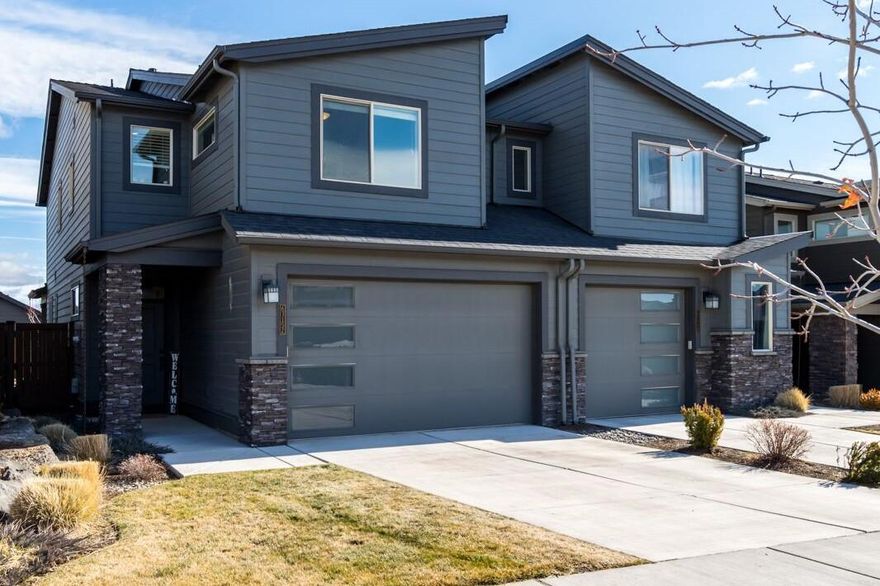 Charming Pahlisch townhome located on a quiet tree-lined street in NE Bend! Contemporary design and immaculately maintained, this 3BR/2.5BA townhome built in 2016 features quality finishes throughout. Delightful Great Room offers cozy gas fireplace with stone surround and opens to spacious cook's kitchen with solid surface countertops, Stainless Steel appliances, ample Knotty Alder cabinetry and space for additional seating at the breakfast bar. Light and bright Dining area with direct access out to covered patio and low maintenance fenced backyard. Upstairs: Private Primary Suite with peek-a-boo Cascade view, walk-in closet and solid surface dual vanity, plus 2 additional bedrooms, 2nd full bath and convenient laundry room. Fantastic 2 car garage, A/C and only one shared common wall. Moments to popular Boyd Park and close proximity to schools, shopping, 10 Barrel Brewing Eastside, and neighborhood trails.