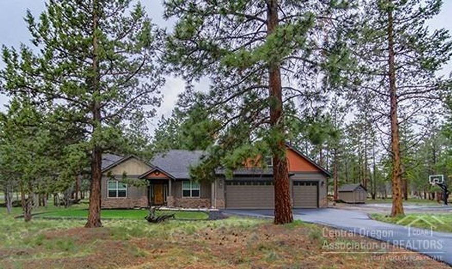 This beautiful craftsman style home sits on a treed 2.5 acre lot just 6 miles from the desirable town of Sisters. The slate entry features a sliding barn door to a home office, and opens to the vaulted great room, featuring hand-scraped birch hardwood floors, and a floor to ceiling stone fireplace flanked by windows with views of the back patio and yard. The great room opens to the kitchen and dining room, where you will find custom knotty alder soft close cabinetry, KitchenAid appliances, 13' of buffet cabinets, and walk-in pantry. The master has an angled tray ceiling, stained knotty pine accent wall, ceiling fan, and blackout blinds. The master bath features heated tile floors, an oversized 6' soaking tub, walk-in shower, dual vanity raised countertop, and expansive walk-in closet. On the opposite end, you will find two roomy bedrooms and full bath. Upstairs, the large bonus room features an electric fireplace with mantle, a large east facing window, and a bathroom with shower.