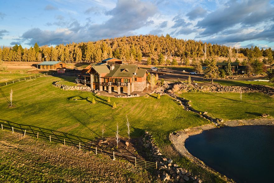 Gorgeous 33.78 ±acre Tumalo farm, with 2 legal dwellings: a 2017 Johannessen Builders custom home and an original built 1927 2nd home, remodeled/updated. The 2016 custom home boasts many luxurious features: a main master ensuite bath/bedroom with a sauna, large custom walk-in closet, fireplace, and exercise room. A 2nd master ensuite bath/bedroom. Beautiful hardwood floors throughout, wood framed windows, Cement Elegance counters, Wolf appliance kitchen, dry bar/large pantry, vaulted ceiling great room with floor to ceiling stone fireplace, and geothermal heating. Trex decking with pergola along the back of the home featuring epic Cascade Mountain views. 2nd home has a new kitchen, 2 master bath/bedrooms, 3 guest rooms/1 shared bath. The Farm consists of 25 ± acres of irrigated ground, re-planted in '21, a custom-built horse barn, 60± ton hay barn and perimeter fencing. Fully landscaped with a pond/water feature that is a visual treat. This is a one-of-a-kind gorgeous Tumalo property!
