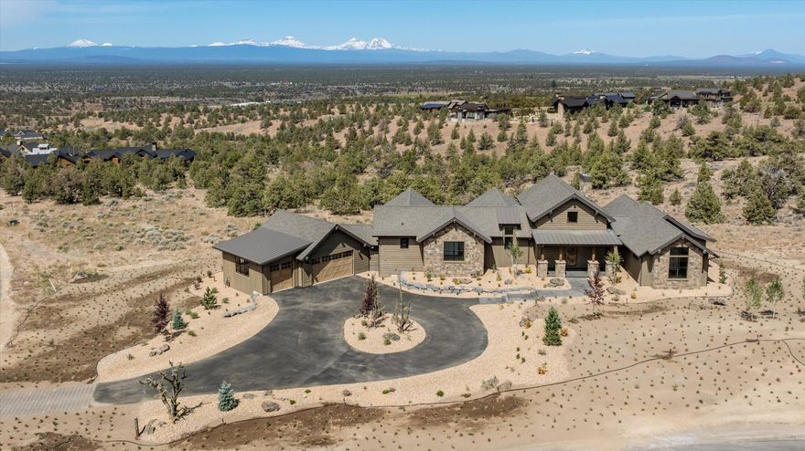 Impeccable NW Style New Construction home with breath taking views of the magnificent Cascade Mountains off of the spacious back deck. This home offers an open floor plan with hardwood floors throughout, a capacious kitchen, a pantry with an office space and custom-built ins, an open dining room, and a great room that features a solid stone fireplace that expands to the vaulted ceiling. Enter the primary suite to continue the gorgeous views and exit onto the back deck to enjoy the famous sunsets behind the Cascade Mountains. The primary bedroom also boasts of a large walk-in closet, double vanity, a soaking tub, and a floor-to-ceiling tile shower. Additionally, you will find two additional bedrooms with a full bathroom, a large laundry room, and a generous three bay garage complete the home.