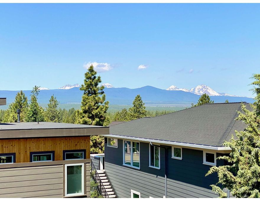 Situated on Bend's West side in the new Marken Summit neighborhood, located near shopping, schools and restaurants. This Northwest Modern style home takes full advantage of the Cascade Mountains with amazing views from Bachelor to North Sister. The home features a creative selection of finishes and an efficient floor plan fit for any buyer. Enjoy the impressive primary suite featuring large walk in closet, tiled shower, and double vanities. Also upstairs you will find two bedrooms as well as a generous sized bonus room. Another bedroom downstairs would function well as an office or den. The kitchen features custom cabinets, a large island and slab quartz countertops as well as stainless steel appliances. 2 car garage with an additional shop/storage space. Earth Advantage Certified and built by Stone Bridge Homes NW.