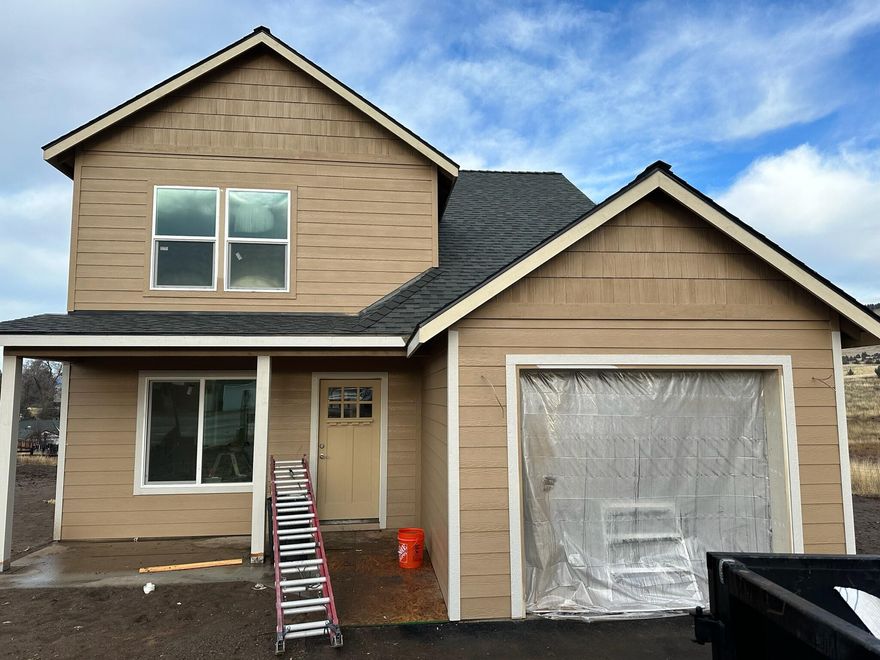 New construction located in a newer subdivision!  Downstairs features living room,
dining room, kitchen, laundry room and 1/2 bath with 3 bedrooms, 2 bathrooms upstairs.  This home will have custom wood cabinets, granite counters, engineered hardwood floors, tile and carpet throughout with gas forced air heat and air conditioning.  Covered front and back decks, fenced backyard with some landscaping and sprinklers  in front.