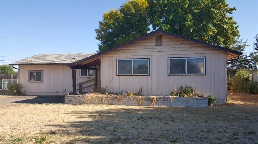 This 3 Bedroom, 1.5 Bath home with nearly 1,400 square feet of living space is just waiting for your TLC! Huge yard, covered back patio, mature trees, brick fireplace and more. With the right touches this could be the home for you.