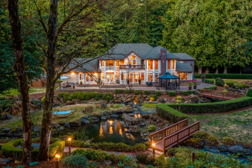 Private garden sanctuary nestled conveniently close to Sandy Oregon and the recreational haven of Mt. Hood National Forest. This income producing oasis features an exquisite custom built 4465 sq. ft. 4 bed, 3 1/2 bath home with intricate finish work and attention to detail. The chef's kitchen is ready for your families memories with two islands, custom cherry cabinets, granite counters, pantry, and breakfast nook. The family room has soaring floor to ceiling windows, with views of the manicured creekside yard that resembles the Oregon Gardens with a waterfall, gazebo, and many nooks you can hide away from the day in. The home also includes a large office, formal dinning room and living room, dry bar, and game room. This inspiring home and landscape also includes an OLCC tier 1 mix use cannabis producer license that creates a steady income year-round with its professionally built 5000 sq. ft. shop with 4 fully automated, indoor flower rooms and separate trim and dry/cure rooms.