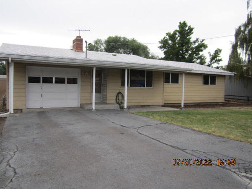 Investors and contractors Wanted !!  Three bedroom 1 bath priced according to condition of the property.   CASH only sale.  AS IS condition.  Living room with fireplace, some hardwood flooring, vinyl windows & gas forced air heat.  Fully fenced flat backyard with storage shed and room for flower or veggie garden.  RV Parking.  Written invoice from licensed contractor of repair work needed.  Will be given to serious buyers.