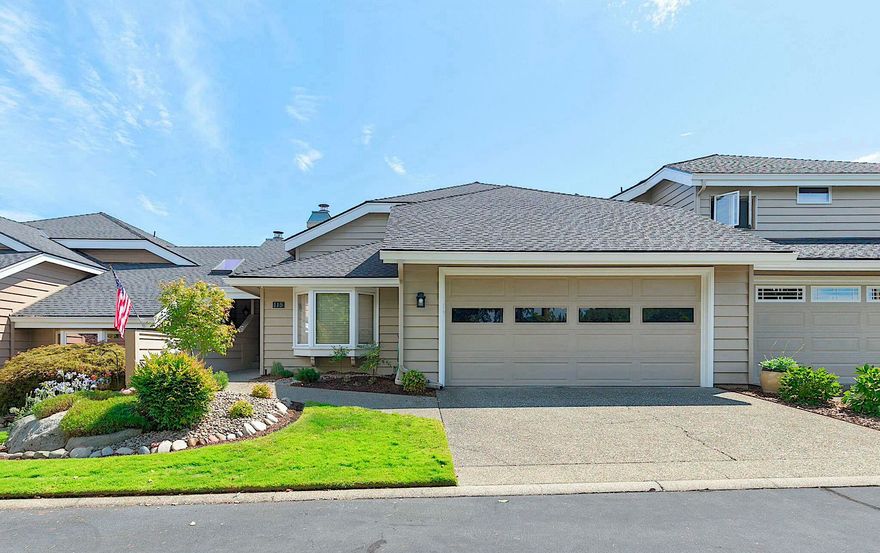 Stunning townhome in the highly sought-after Rogue Terrace Development, an exclusive private community. As you step into this 2 bedroom, 2 bathroom home you'll immediately appreciate its beauty and elegance. The soaring vaulted ceilings and expansive windows flood the space with natural light, while the plantation shutters and new flooring add a touch of sophistication. The spacious and inviting layout includes a cozy living room with a gas fireplace, and a beautiful kitchen equipped with ample cabinetry, new appliances, and a convenient coffee bar. The primary bedroom, located upstairs, offers a serene retreat with a large bathroom featuring a soaking tub, dual vanity, and an expansive walk-in closet. Enjoy your morning coffee on the private balcony overlooking the peaceful surroundings. Located within a private community with direct access to the breathtaking Rogue River, this home is a must see!