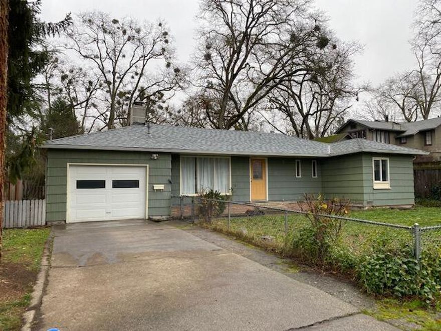 This 2-bedroom 2-bathroom cottage is a rare gem in a charming neighborhood of lovely homes. Built in 1951, it features an additional room that could be a 3rd bedroom or great office space. The spacious living room offers a cozy fireplace and beautiful hardwood floors.   The French doors lead to a sun filled room that could be a dining room, family room or whatever you desire. The large, bright kitchen has tons of storage and counter space.  Lots of mid-century features add warmth and charm throughout. The generous lot is fully fenced, and the back yard is complete with a nice partially covered patio. Office and attached bathroom have a separate entrance (off garage) allowing for many possibilities. AHS Home Warranty included. You won't want to miss this one!