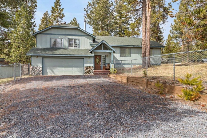 Lovely home that has beautiful vaulted ceilings and hardwood floors throughout. Spacious open floor plan with large windows in living and kitchen area. There is a bonus bedroom and bathroom through separate entrance off of the garage. Large yard that is fully fenced. Access to private boat ramp. Incudes shop/storage building in yard.