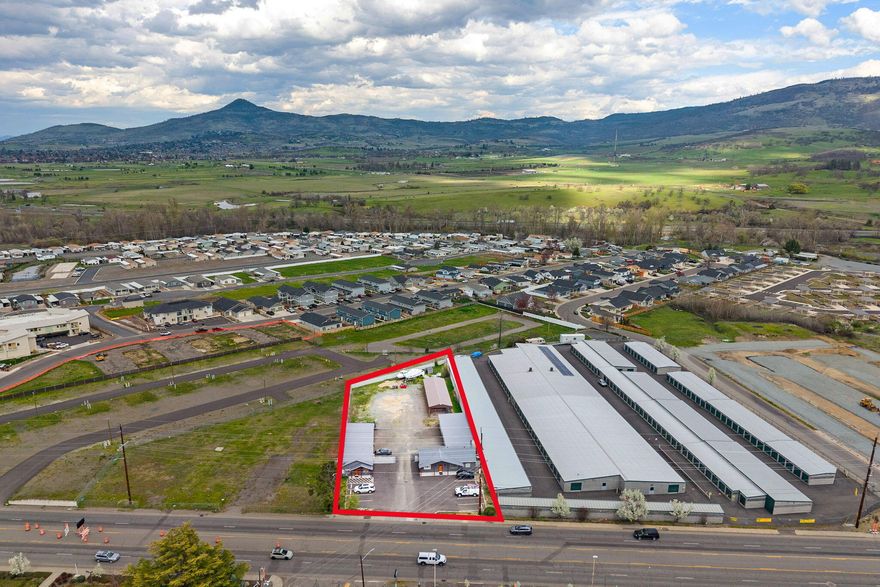Brand new in 2021, this property offers an abundance of opportunities! Totaling 5,028 SF, 3847 S Pacific Hwy is 2,792 SF with office space, kitchen and meeting areas, two bathrooms and finished garage/warehouse space. There is also an eight bay, 1,920 SF carport. 3839 S Pacific Hwy is 2,236 SF with a similar design, one bathroom, and currently operates as a salon. The .84 acre lot has ample room for additional buildings or expansion. It is fully fenced and zoned General Commercial allowing for a variety of potential uses. The buildings share an asphalt parking lot with 10 spaces. Traffic counts in this area of Hwy 99 total 15,000+ vehicles per day. Owner carry considered with a large down payment.