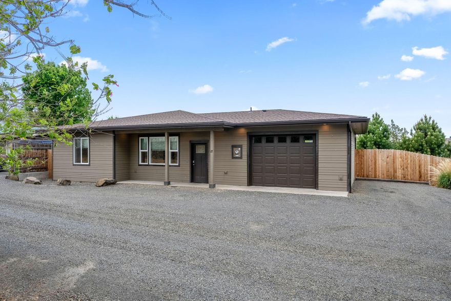 Built in 2018, this lightly lived-in, wheelchair accessible home is move-in ready! Featuring 2 bedrooms and 1 bath, it offers an open-concept design with wood-look tile floors, wide doorways, and stylish finishes throughout. The kitchen is complete with granite countertops, stainless steel appliances, and a spacious island ideal for gatherings. The bathroom includes a beautiful walk-in tile shower with custom accents and light up mirrors. Enjoy modern comforts, an oversized attached garage, and a private backyard with a patio. Located in a peaceful neighborhood—comfort, convenience, and quality all in one! Beautiful mountain views!