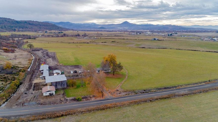 Your own private paradise tucked away from the hustle and bustle yet only minutes to Medford or Eagle Point. This beautiful piece of irrigated Southern Oregon farmland currently yields approximately 105 ton of hay per year. The 39.78 EFU acres (32.6 irrigated) are level to very moderately sloped with full southern exposure. The 3 bedroom home, pole barn and additional outbuildings are modest yet functional making a nice addition to any farming, livestock or Ag activities. This gorgeous property is a rare find and priced to sell; don't wait to schedule your tour! Owner carry possibly considered with a minimum of $400k down.