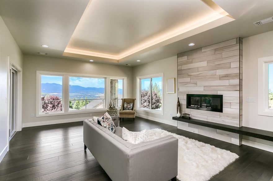 Stunning new contemporary style home w/panoramic valley views & inviting outdoor spaces including outdoor kitchen complete w/gas fireplace for cool summer evenings. Soaring entry w/upper level main living this home is ideal for entertaining & features a center island kitchen w/all stainless Electrolux appls, Bosch refrigerator, double ovens, butler's pantry, wine cooler & walk-in pantry. Architecturally designed for comfortable living w/Great room plan, 9ft & coffered ceilings, hardwood floors, gas fireplace w/floating stone hearth & formal dining. Private master ste offers expansive views, lg walk-in closet, extensive Quartz vanity, free-standing tub & walkout shower! In-home office/4th bdrm, framed & wired for elevator makes this home ideal to age in place, great built-ins w/custom finishes & designer lighting. Fully landscaped & fenced w/3-car attached garage, this home is gorgeous & ready for you to call home! (One owner is licensed real estate broker in the state of Oregon)