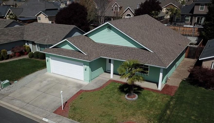 First time buyer's paradise! Great location in Central Point with a huge park nearby. Fantastic neighborhood for kids, the $70 HOA dues get you access to the pool, clubhouse, tennis courts, and play structure. This beautiful home has big vaulted ceilings, with many decorative areas above to place lights, plants, or use for extra storage. A gracious master with a walk-in closet, and ample sized rooms means you never feel boxed in. The Xeriscaped back yard has a pad(and wiring) for a hot tub, complete with an AstroTurf strip for your puppies to do their thing. In-ground sprinklers in the front, and great curb appeal round out this wonderful home. Video Tour Available here: https://youtu.be/IXoOj5h4yD8