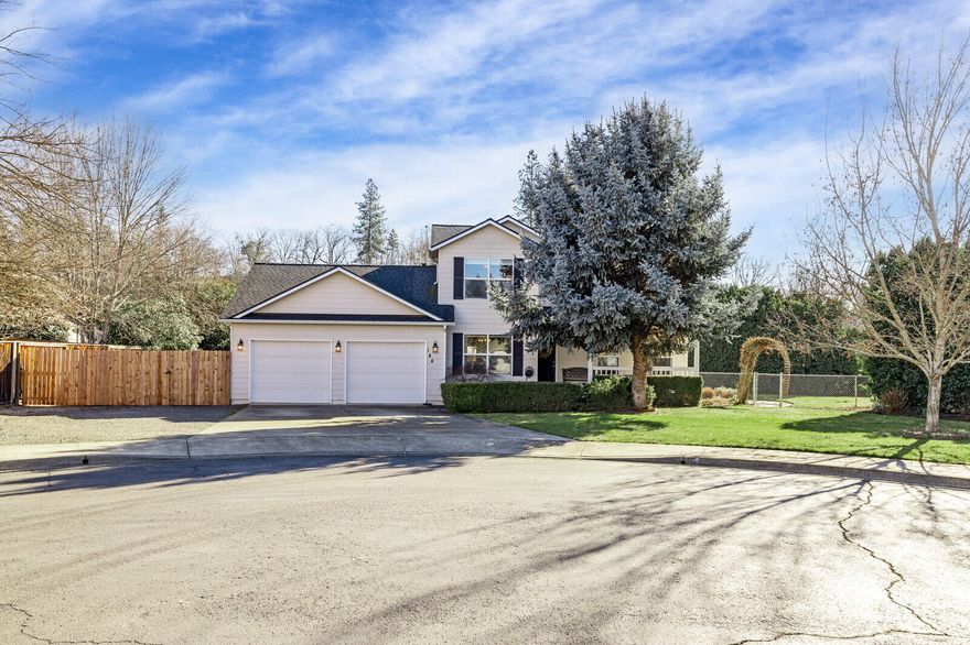 Immaculate family home. This beautiful 2 story 3 bed 2.5 bath home has been fully remodeled & sits on a lg 1/3 acre lot in a quiet cul-de-sac. Perfectly located near the Eagle Point golf course community. Features new laminate wood flooring throughout, new interior paint, newer 40-year comp roof w/gutters, updated stainless-steel appliances including a gas stove & coffee bar. Sunny breakfast nook & separate dining rm. Remodelled gas fireplace, newly rebuilt stairs w/runner & new window treatments & curtains throughout. You'll love the fully fenced parklike backyard that's completely private. It has mature shade trees, 2 apple trees, gardening area, lg covered deck for BBQs & entertaining, inground sprinklers, flagstone pathway throughout, garden shed & tons of RV parking in the front & back! Other features include an oversized garage, covered front porch,2 walk-in closets & dreamy laundry room w/utility sink & lots of room. This home has many windows & an abundance of natural light.