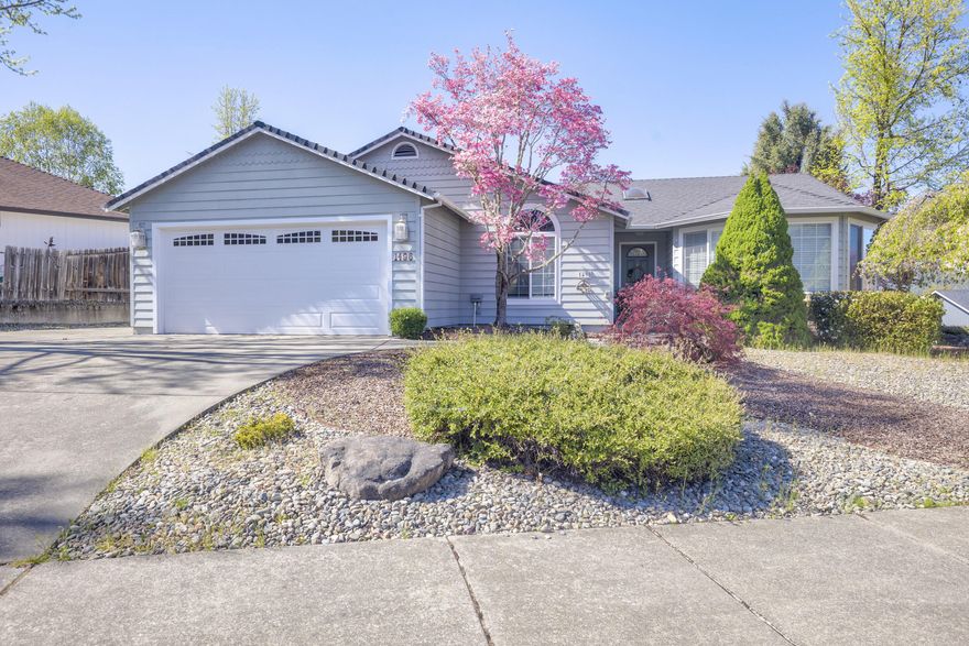 This super clean, one owner, move-in ready three-bedroom, two-bath home boasts a spacious 1,611 square feet of thoughtfully designed living space. With big bay windows in the living room, this home features a beautiful combination of tile and Elmwood flooring throughout the home  providing a warm and inviting atmosphere. You will love the custom tile countertops and the oak cabinets in the kitchen and built-in serving hutch in the dining room and gas fireplace for added comfort. The large primary suite is extra nice with adjoining bathroom and walk-in closet with additional shelving.   Perfect for entertaining or just a weeknight dinner, you will enjoy the spacious deck with mountain views.  This corner property not only provides ample space and privacy, it also has plenty of room for an RV (has water and electric hook up)  or boat. Call to see this beauty today!