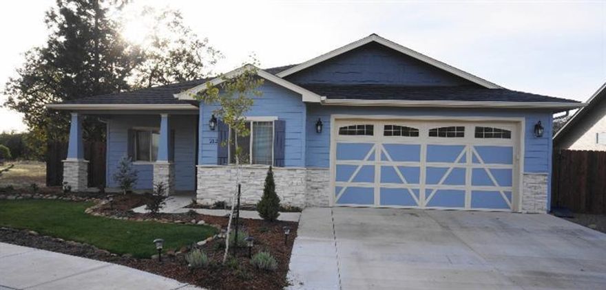 Fantastic custom built home located next to the famous Rogue River. Built in 2014 and like new this home boasts exotic granite counter tops, built-in entertainment center, wired for sound and USB Networking, Wood burning fireplace custom ceramic tile flooring, 3 bedrooms - 2 baths, 2 car garage with 2170 Sqft! This kitchen has custom Maple (soft Close) cabinets, dishwasher, disposal, microwave with an open floor plan.. Large master has a walk in travertine shower and walk in closet, dual sinks. Completely fenced with Front landscaped and sprinkler system - RV parking with hook-ups. Just minutes away from The Rogue River and the Rogue Regional County Park where you can fish for Salmon, trout and steelhead! This subdivision is on a public water system with great views of the surrounding mountains. Don't miss this opportunity to live near the river in this beautiful home. A Must See!