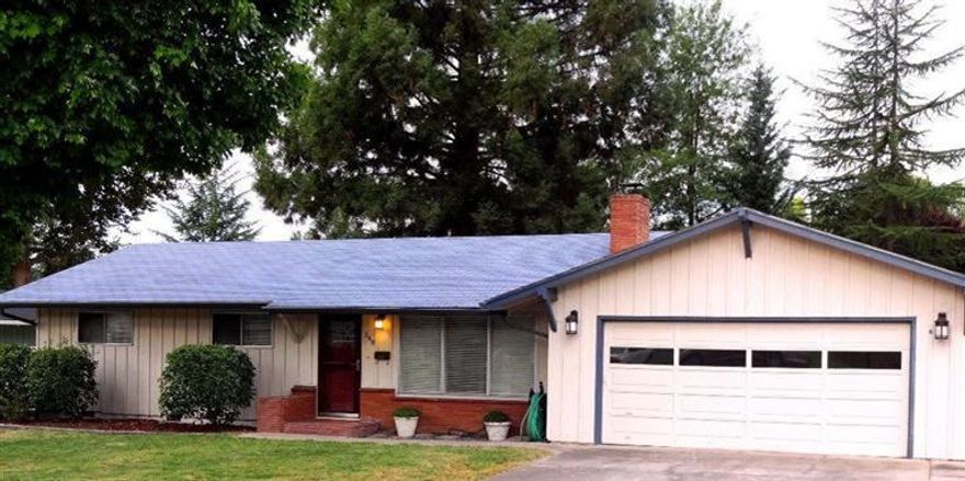 East Medford charmer...This home has been remodeled and has kept plenty of character from the 1950's. The owners have refinished the original hardwood floor along with a complete kitchen makeover. The kitchen boasts pristine cherry wood cabinetry along with a beautiful tile back splash to accent the granite counters. This home has not only one BUT two family rooms that have wood burning fireplaces, for that extra cozy warmth in the winter months. Two sets of double French Doors open up to a secluded backyard wilderness, in the middle of East Medford. The mature landscaping offers privacy and relaxation after a long day at the office.