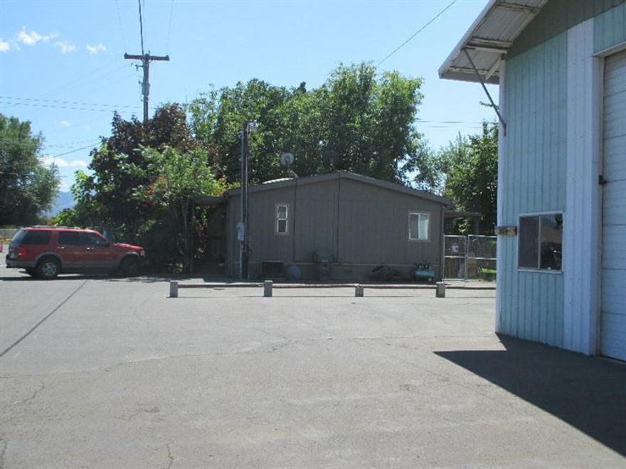 Back on market at no fault of property. Affordable Manufactured Home with Big Shop!! It could make a great home/workplace.