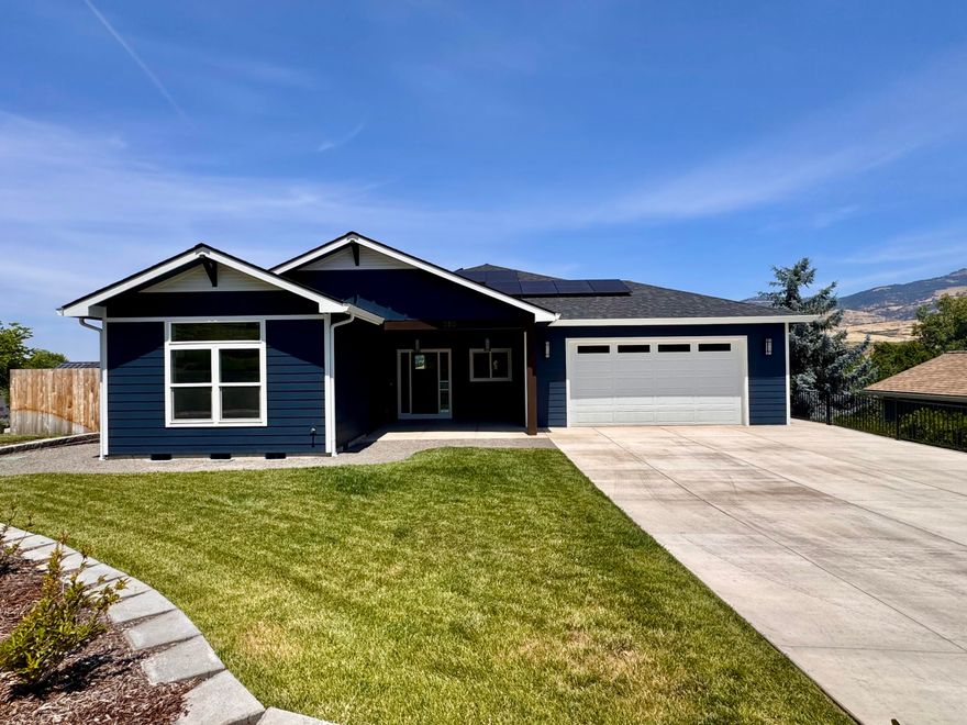 A new Taylored Elements Construction home of this quality and location don't come around often with views that are second to none of Grizzly Peak, bluffs & valley all while being less than a mile from downtown. The main level is 2057 sq ft, 3 bedrooms, 2.5 bathrooms, with an open floor plan, engineered hardwood floors, beautiful functional kitchen with high grade appliances, pantry, quartz counter tops, custom cabinets with soft close drawers, tiled backsplash, niche and large island. The spacious living area has a gas fireplace and access to 2 decks. The primary suite has a coffered ceiling, walk in dual headed shower, dual vanity & large walk-in closet. The 945 sq ft lower level has a separate exterior entrance, will be finished as bonus space with a full bathroom and is prepped to be an ADU per the plans. This energy efficient, comfortable and sustainably built Earth Advantage Platinum home has an 8 kw solar panel system & EV charger in the oversized 2 car garage. Come see it today