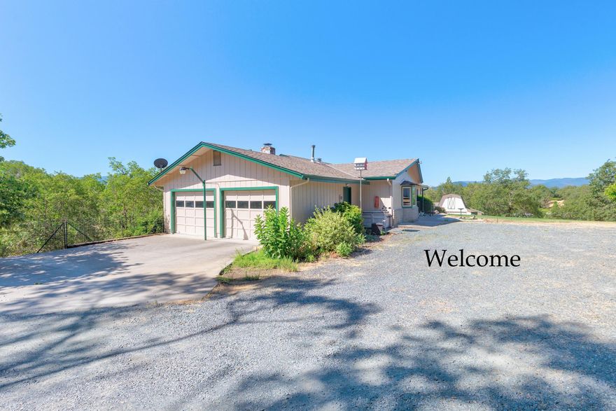 Built in 1976, this single level, 2,140 sf  home, with a primary bedroom and  2 guest bedrooms, 2 baths. with an open floor plan, sits on 2.62 acres and is close to town,   Forced air heat & A/C.  There is an oversized 2 car garage, fenced swimming pool with a slide, a barn /shop with a hay loft and large workbench.  Horse stables with 3 individual stalls. The interior of the home includes a kitchen with Corian counter tops, breakfast bar, electric range, refrigerator, dishwasher large pantry. Also a dining room and a living room with wood burning, brick fireplace.  There is a large den/family room with enclosed laundry area, a built-in desk and a large bookcase. Ceiling fans in most rooms. There is an enclosed, screened deck off the dining room and a patio off the pool area. There is a pond in front of the house.  The Exterior of home recently painted. Wood Stove in den is not certified and will be removed by seller. Firewood in the stables is included.   Inspections have been done.