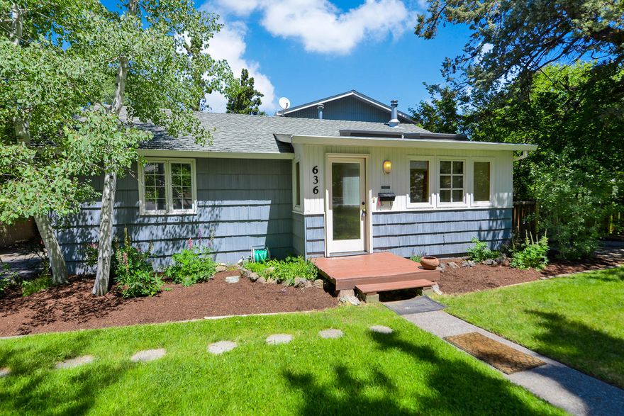 Ultimate Midtown Charm! This darling home combines the sought-after midtown location with beautiful, modern updates throughout. The flowing plan boasts new paint, skylights allowing loads of natural light, new flooring, wood windows and a spacious deck ideal for entertaining.  The roomy updated kitchen features stainless appliances, an eating island, and on-trend cabinetry and countertops. The spacious upstairs master suite exudes character and allows morning coffee on your own private deck. The quaint bathrooms have been completely redone and have full tiled showers. The manicured ¼ ac. lot is fenced in the back and provides privacy, a greenhouse and plenty of room to garden. There's storage for all your lifestyle gear with both a carport and detached garage.  Ideal location insulated from traffic yet a block from 22 ac. Juniper Park, trendy restaurants and coffee shops, and equally close to both Costco and downtown Bend. Explore ADU potential!  A rare Midtown find.