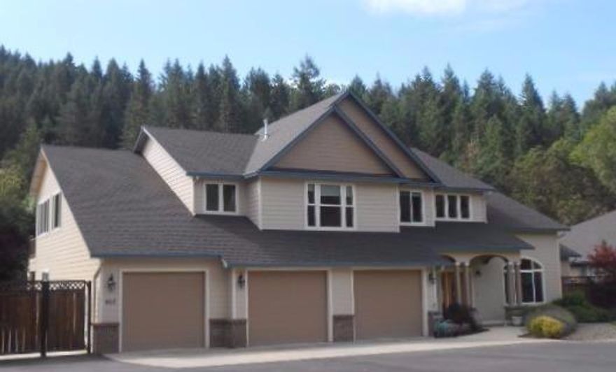 Spectacular gated community home in rural Roseburg yet minutes to city! Move right into this steller custom built home with 5 bedrooms 2 are masters (1 up 1 down) with en-suites; extra sitting area in upstairs master plus an extra room. 3 additional upstairs bedrooms with larger closets. Total 3.5 baths, theatre room, family room formal living and dining rooms, open upscale kitchen, beautiful rich Eucalyptus hardwoods. Large level 1.36 tiered lot w/ seasonal creek. Paved double RV area w/ hookups, 3 bay oversized insulted garage. Add to this a separate shop! Many extra features; ask for amenities list for full list upscale touches. This is a home for the discerning buyer - you won't want to leave!