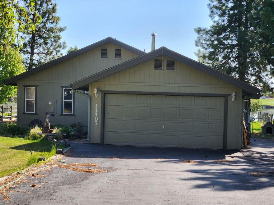 Meticulously maintained RIVERFRONT property in Keno! You'll enjoy sitting on the wrap-around porch of this beautiful home viewing the river sunset. Granite countertops are featured throughout with a galley kitchen, and lots of cupboards and pantry space. Plenty of windows provide panoramic views and welcoming natural light. Open floor plan with great room, gorgeous hardwood floors, wood stove, and ceiling fans provide all the comforts of home! The large primary bedroom has a bath with stall shower. The yard is beautifully landscaped and fenced with an in-ground sprinkler system. Walk to your own private dock on the river and fish to your heart's content!