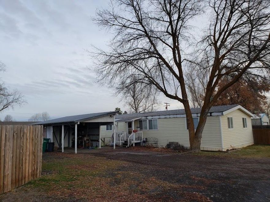3 bedroom, 2 bath MH on a nice lot in the suburbs with a good rental history. Extra room could be an office or 4th bedroom. Large master suite with outside access. Carport with storage space, RV parking, fenced yard and covered back deck. Make your appointment today!