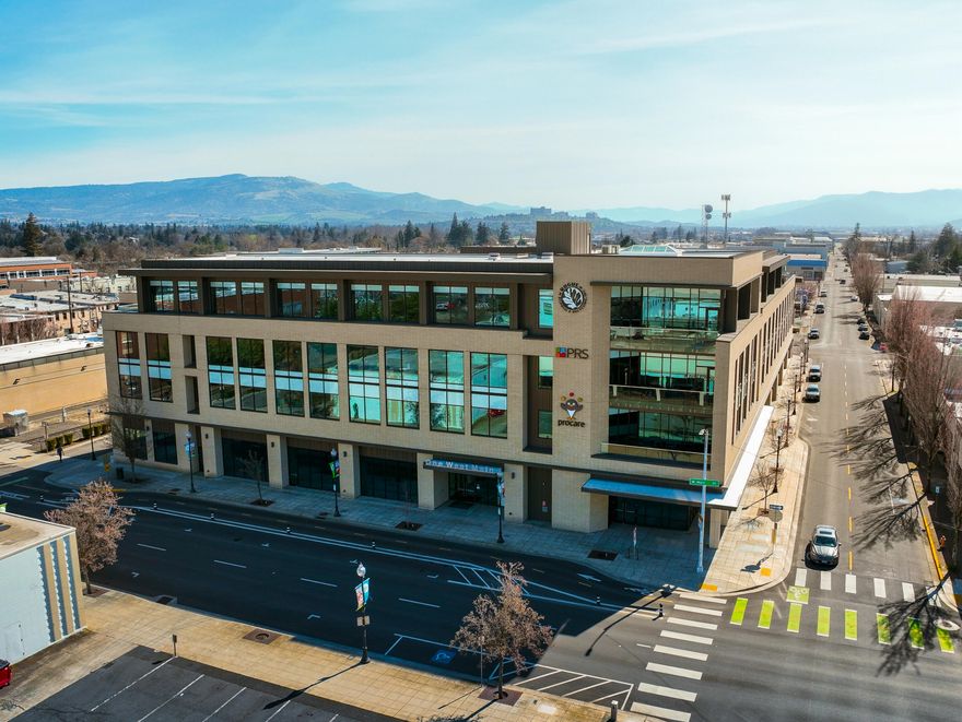 Modern, immaculate, turn-key office space in one of Medford's premier professional office settings. This well-appointed space has served as the corporate headquarters for ProCare Software and is now available. This offering is for the entire 2nd floor of the One West Main Building in downtown Medford. The 2nd floor condo unit consists of approximately 30,964 total square feet, demised as follows:  19,016 SF finished/furnished office space; 9,972 SF cold shell space, 1,976 common area and bathrooms. The building was designed as a HQ for multiple prominent companies, and is home to Pacific Retirement Services (3rd floor) and Rogue Disposal (4th floor). Attached to a private parking garage with ample covered parking for all employees/staff. The space is also available for sale per separate MLS listing.